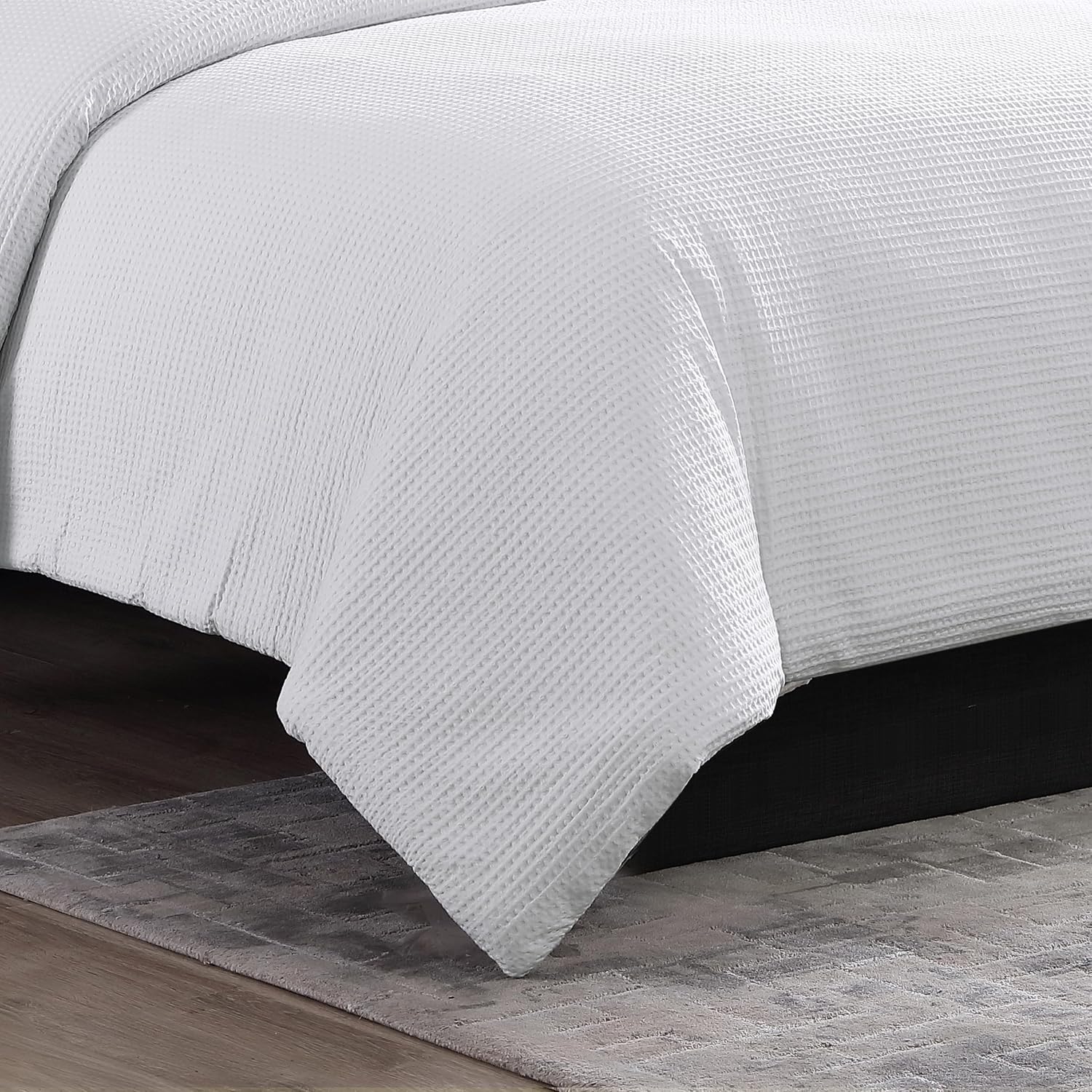 Close view of white cotton waffle pique bedding